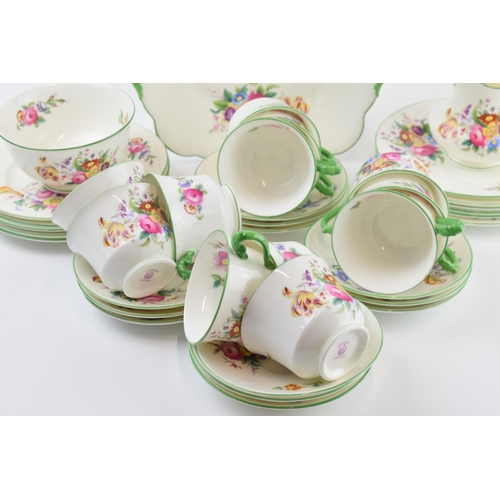 162 - George Jones & Sons Crescent China tea set in a floral green design to include a cake plate, a milk ... 