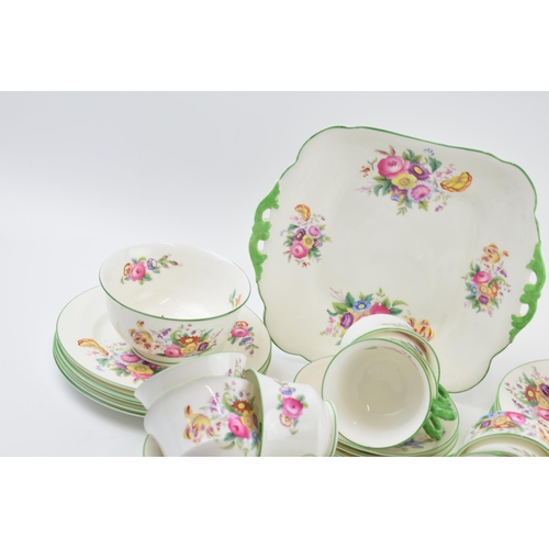 162 - George Jones & Sons Crescent China tea set in a floral green design to include a cake plate, a milk ... 