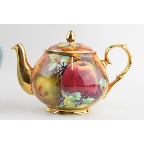 163 - Wedgwood Queensware white on blue teapot (slight af) together with a Everill and Smith fruit scene t... 