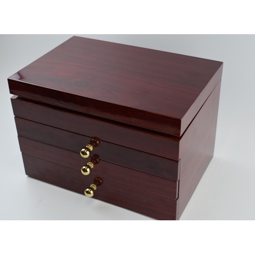 211 - A modern wooden jewellery case with folding lid and pull out drawers with a collection of costume je... 