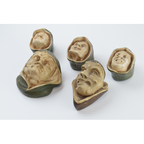 311 - Unusual vintage cast plaster wall hanging busts in the form of beggars and evil looking character, o... 