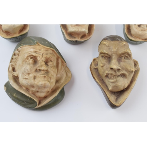 311 - Unusual vintage cast plaster wall hanging busts in the form of beggars and evil looking character, o... 