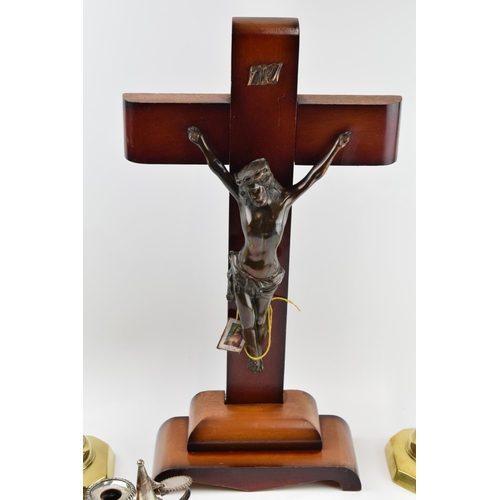 319 - A large wooden and metal religious church crucifix together with an ecclesiastical style pair of bra... 