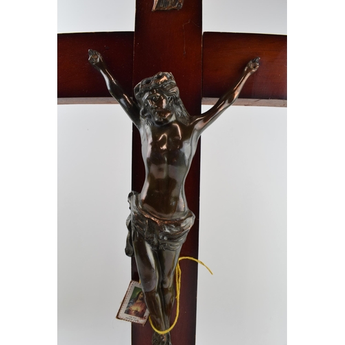 319 - A large wooden and metal religious church crucifix together with an ecclesiastical style pair of bra... 