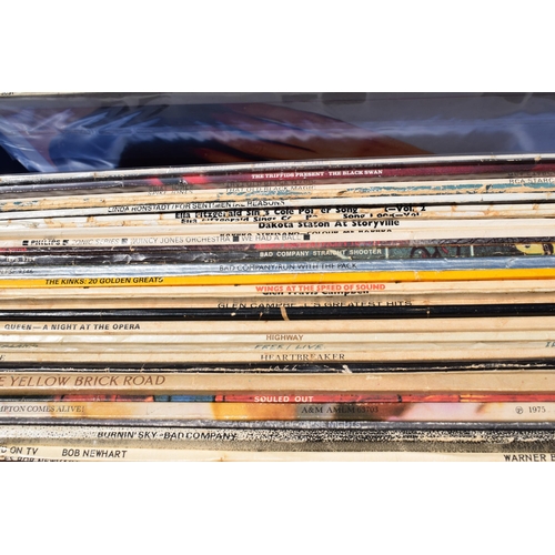 321 - Two boxes of records of varying genres to include Rod Stewart, the Kinks, Bad Company, Barbra Streis... 