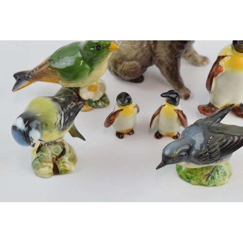 70 - Beswick animals to include a penguin with 2 penguin chicks, a koala and three birds (7).