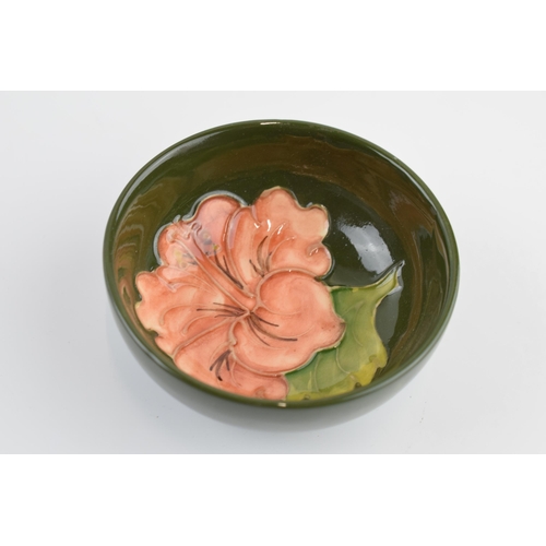 81 - Moorcroft small shallow bowl with hibiscus on green, 8.3cm diameter.