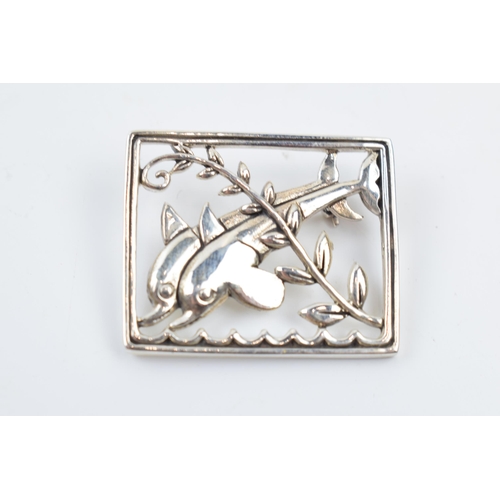 244 - Danish sterling silver brooch with leaping dolphins, 9.8 grams, 35mm wide.