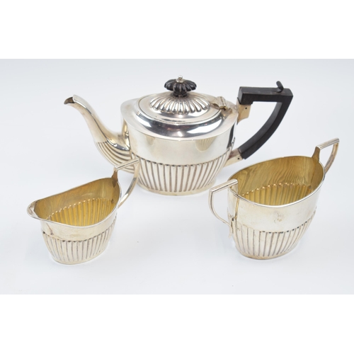 Hallmarked silver 3 piece tea set to include teapot with ebonised handle, milk and sugar bowl, total weight 390.2 grams / 12.55 oz.