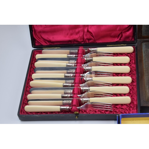 275 - A set of 4 cased cutlery sets / canteens (4).