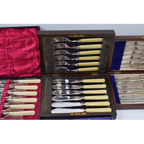 275 - A set of 4 cased cutlery sets / canteens (4).