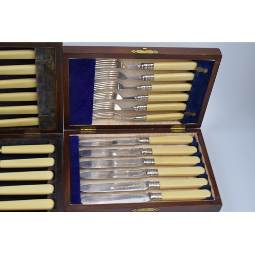 275 - A set of 4 cased cutlery sets / canteens (4).