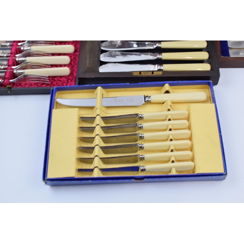 275 - A set of 4 cased cutlery sets / canteens (4).