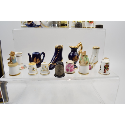 289 - A mixed collection of items to include thimbles by Limoges France and similar manufactures. Together... 