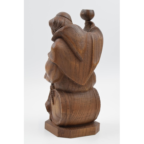 353 - Wooden carving of a gentleman with a goblet, in Black Forest style, 22cm tall.