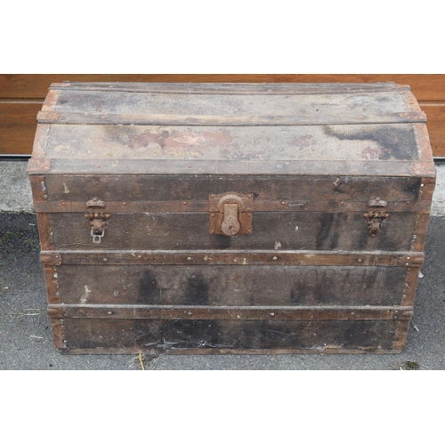 438 - Vintage travelling trunk with domed top, metal bound, 92x52x64cm tall.