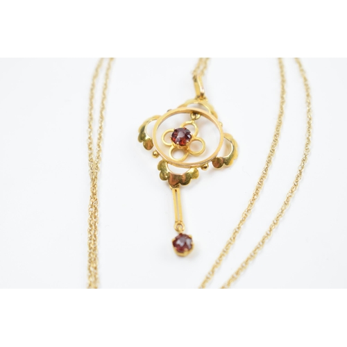 220J - 9ct gold chain with 9ct gold Edwardian pendant set with garnets, 2.2 grams.