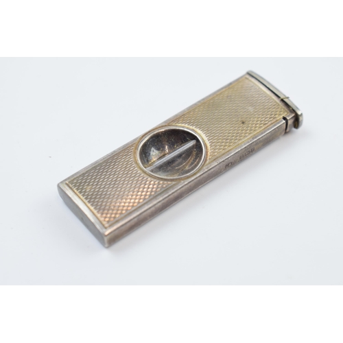 220V - Silver cigar cutter, Birmingham 1966, with a silver topped inkwell (2).