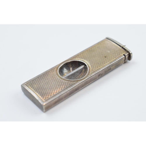 220V - Silver cigar cutter, Birmingham 1966, with a silver topped inkwell (2).