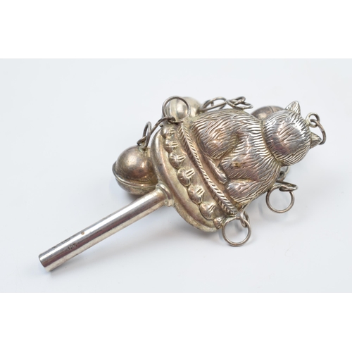 220X - White metal baby rattle and whistle in the form of a cat with bells, stamped '925' but untested, 31.... 