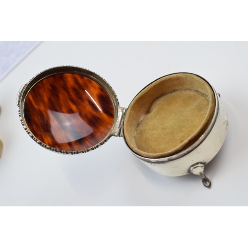 231M - Silver and tortoiseshell lidded trinket box, raised on 3 feet, Birmingham 1929, 7cm diameter.