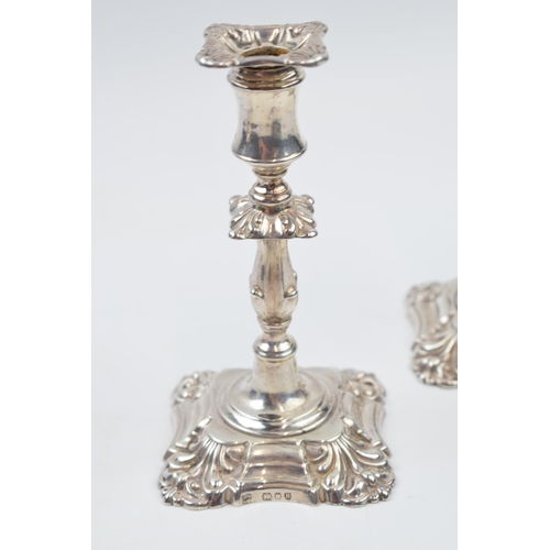 231N - Victorian silver candlesticks with floral design, London 1892, gross weight 212.6 grams.