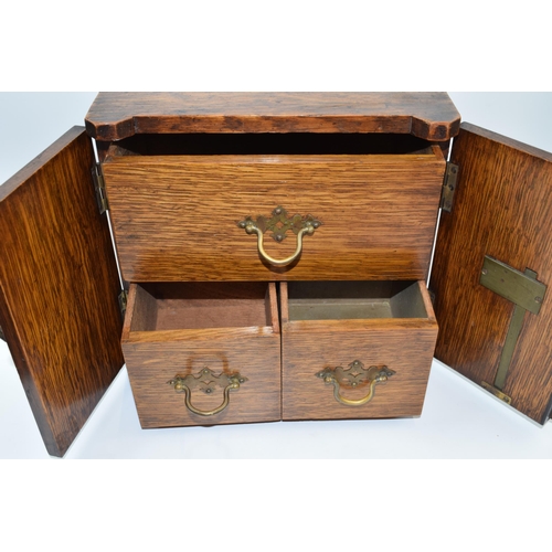 231W - Mid 20th century wooden cabinet with brass fittings marked 'Secure' with 3 drawers behind doors, 26x... 