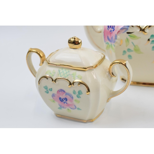 4 - Sadler 1930s cube teapot, milk jug and lidded sugar bowl with a floral pattern (3).