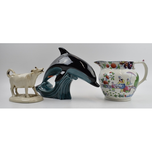 89 - 19th century Pearlware style jug (damaged) with traditional scenes with a Poole pottery dolphin and ... 