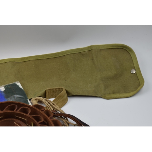 381 - Group of shotgun accessories including quality leather cartridge belt, shooting sock gaiter set, fac... 