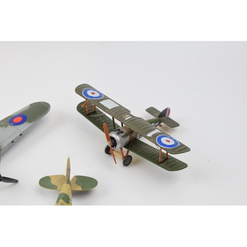 399 - Three model die cast model war planes. Dinky Hawker Hurricane, Corgi Gladiator, Egypt 1940 and a Sop... 