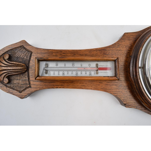 402 - British made barometer and thermometer. Light oak mount and marked 551 to reverse.