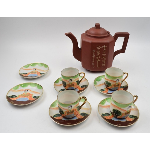 403 - Vintage Japanese teapot together with set of four cups and saucers together with two spare plates.