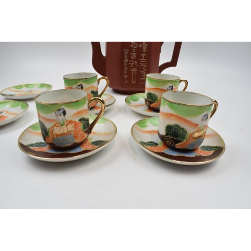 403 - Vintage Japanese teapot together with set of four cups and saucers together with two spare plates.