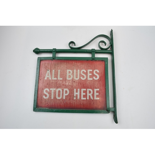 429 - Original 'All Buses Stop Here' enamel sign mounted in metal frame, 36cm long.