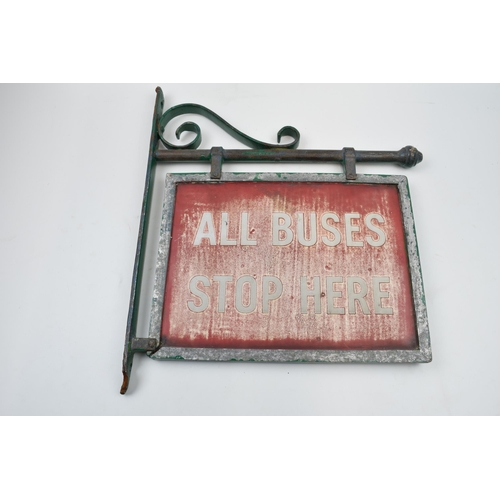 429 - Original 'All Buses Stop Here' enamel sign mounted in metal frame, 36cm long.