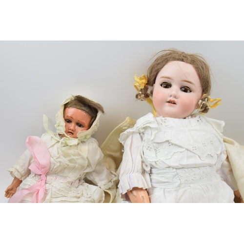 430 - A pair of dolls to include an early to mid 20th century 'Specied' Made in Germany bisque head doll w... 