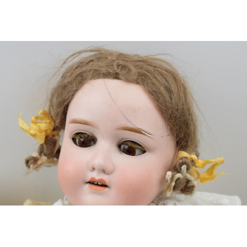 430 - A pair of dolls to include an early to mid 20th century 'Specied' Made in Germany bisque head doll w... 