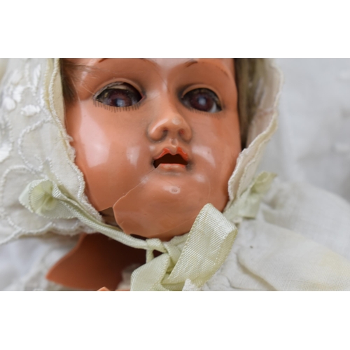 430 - A pair of dolls to include an early to mid 20th century 'Specied' Made in Germany bisque head doll w... 