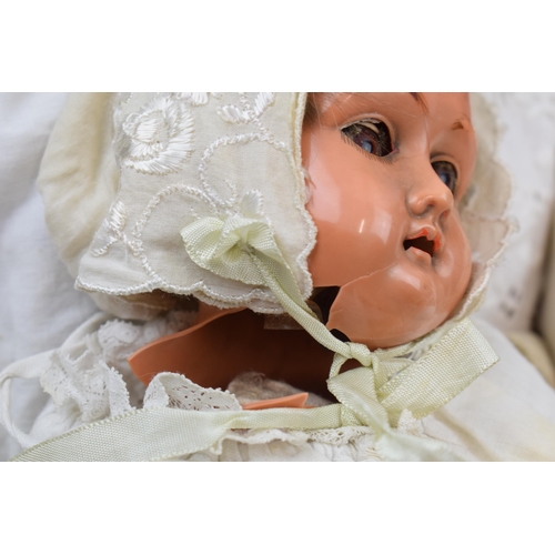 430 - A pair of dolls to include an early to mid 20th century 'Specied' Made in Germany bisque head doll w... 