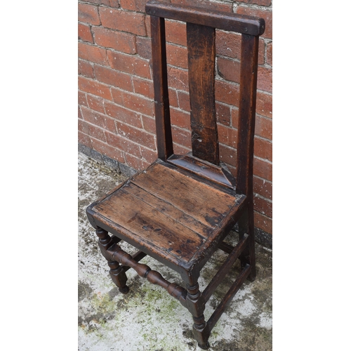 434 - 17th / 18th century oak country hall chair, 100cm tall.