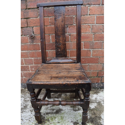 434 - 17th / 18th century oak country hall chair, 100cm tall.