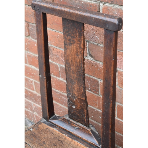 434 - 17th / 18th century oak country hall chair, 100cm tall.