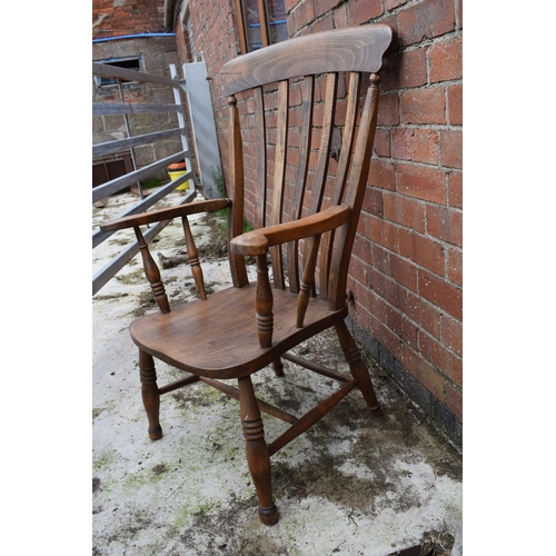 437 - High backed country / farmhouse arm chair with shaped saddle seat, 106cm tall.