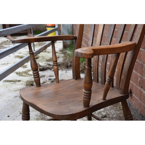 437 - High backed country / farmhouse arm chair with shaped saddle seat, 106cm tall.