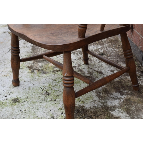 437 - High backed country / farmhouse arm chair with shaped saddle seat, 106cm tall.