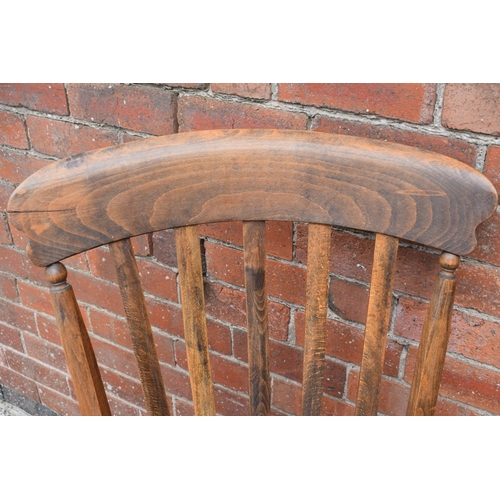 437 - High backed country / farmhouse arm chair with shaped saddle seat, 106cm tall.