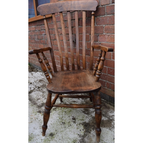 438 - High backed country / farmhouse arm chair with shaped saddle seat, 114cm tall.