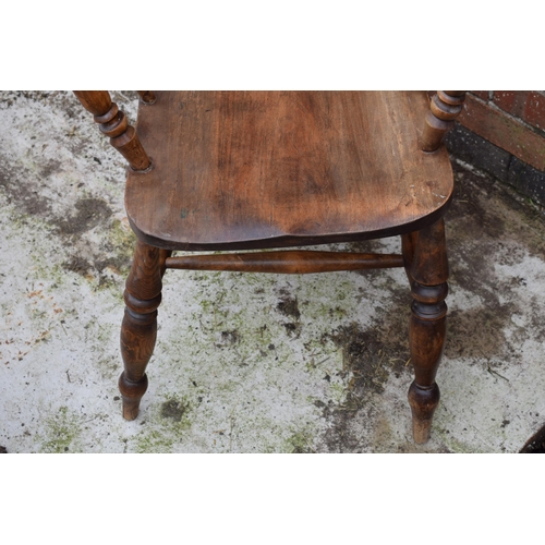 438 - High backed country / farmhouse arm chair with shaped saddle seat, 114cm tall.