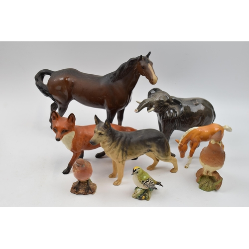 64C - Beswick to include large standing fox 1016, brown swishtail (ear chipped), elephant (tusk af), a mat... 